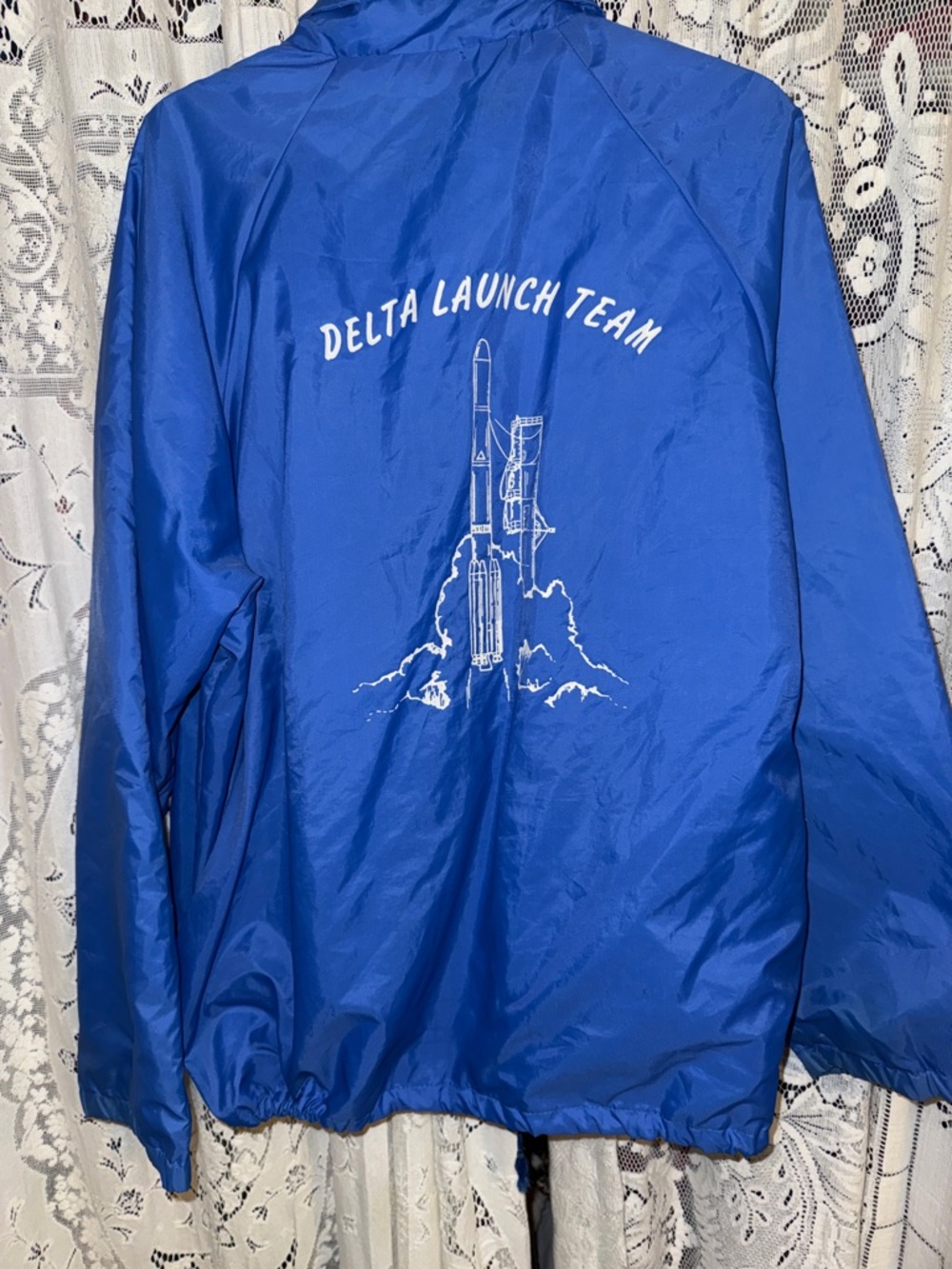 Men's Blue Windbreaker Jacket with Delta Launch Team Graphic